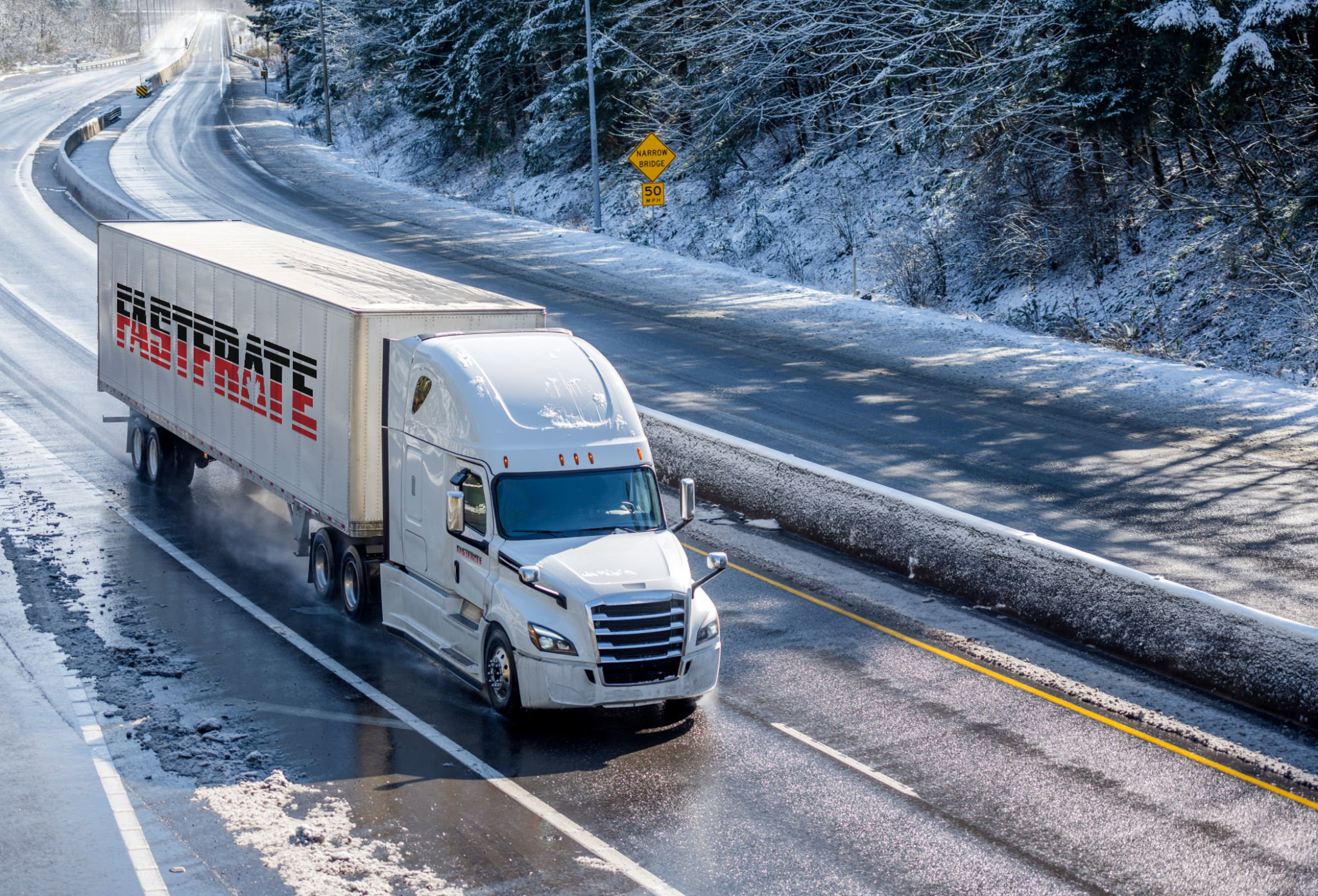 White semi-truck driving on a snowy road with trees in the background