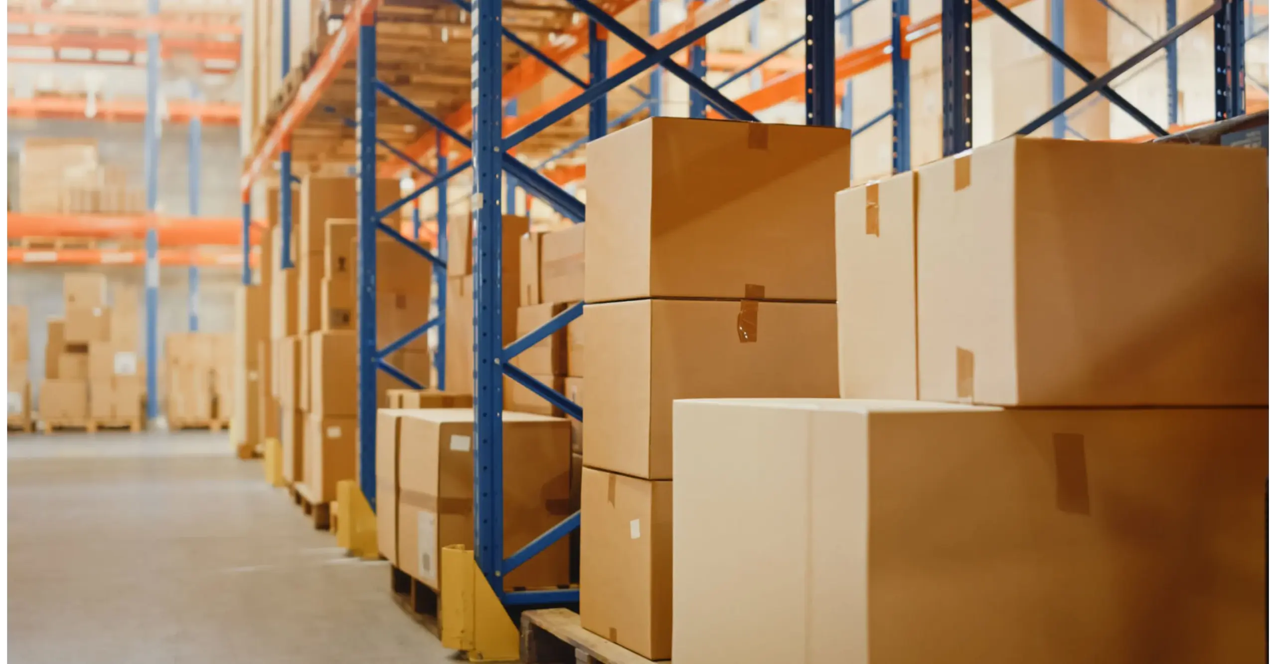 Rows of stacked cardboard boxes in a warehouse setting